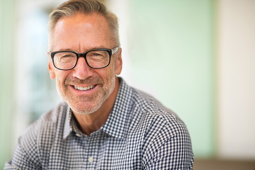 Mature handome fit man wearing glasses outside