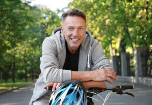 Man on bicycle smiling