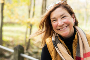 middle aged woman smiling outdoors