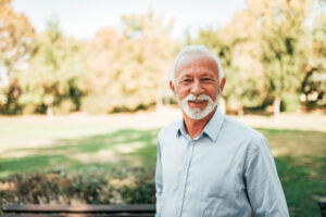 White bearded man standing outdoors