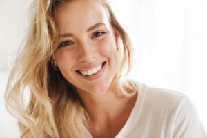 Woman smiling in white tee shirt