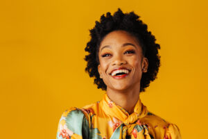 smiling woman on yellow background