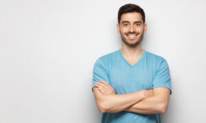 Man wearing blue shirt smiling