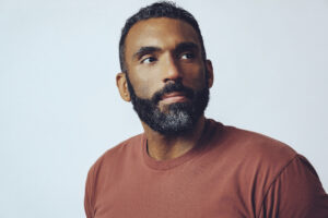 Thoughtful man in red shirt