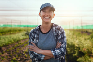 Young farmer outside wearing ballcap