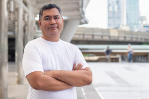 Man in white shirt arms crossed