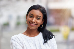 Woman smiling in camera head tilted