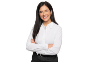 Friendly young woman arms crossed in professional attire